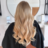 woman with curled long honey blonde hair