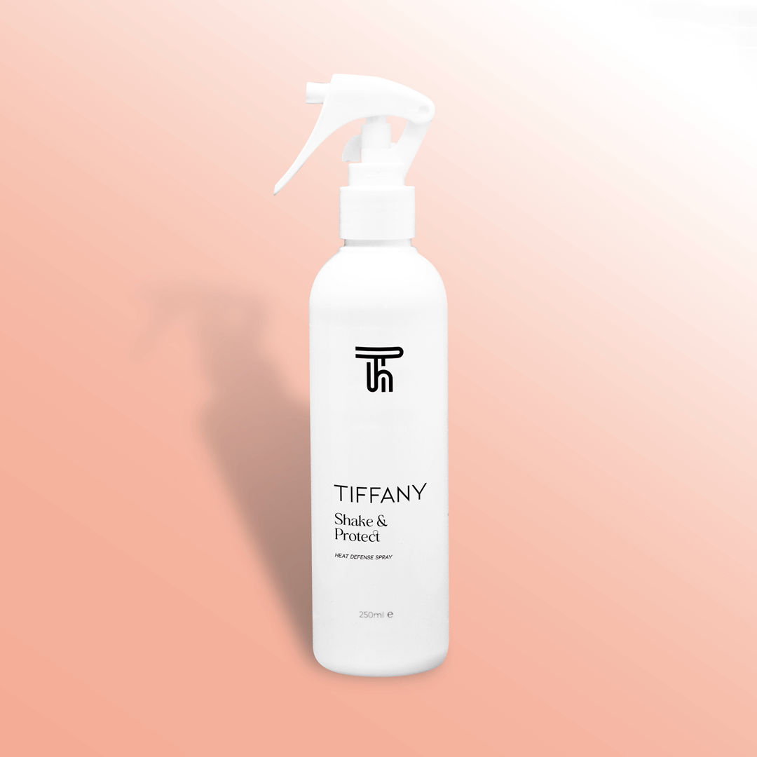 heat defence spray from Tiffany hair on a pink gradient background