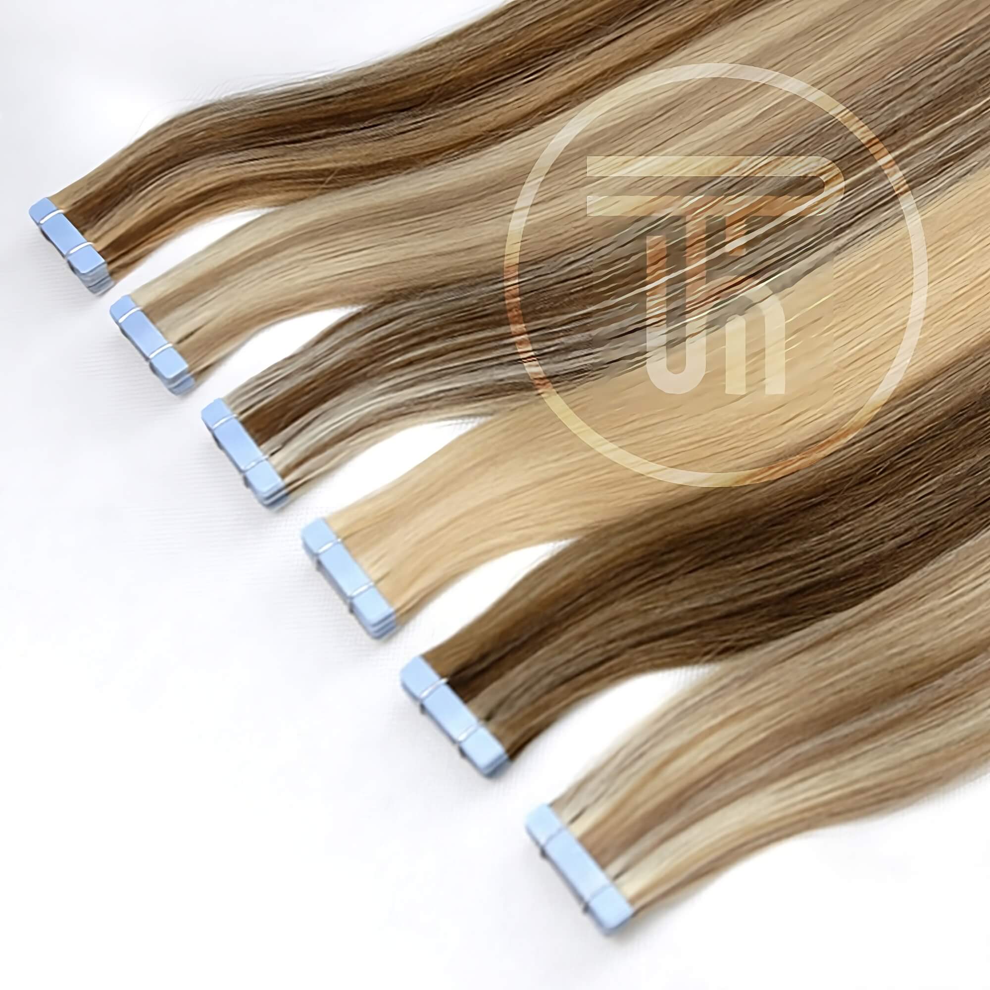 Tape hair extensions in a row