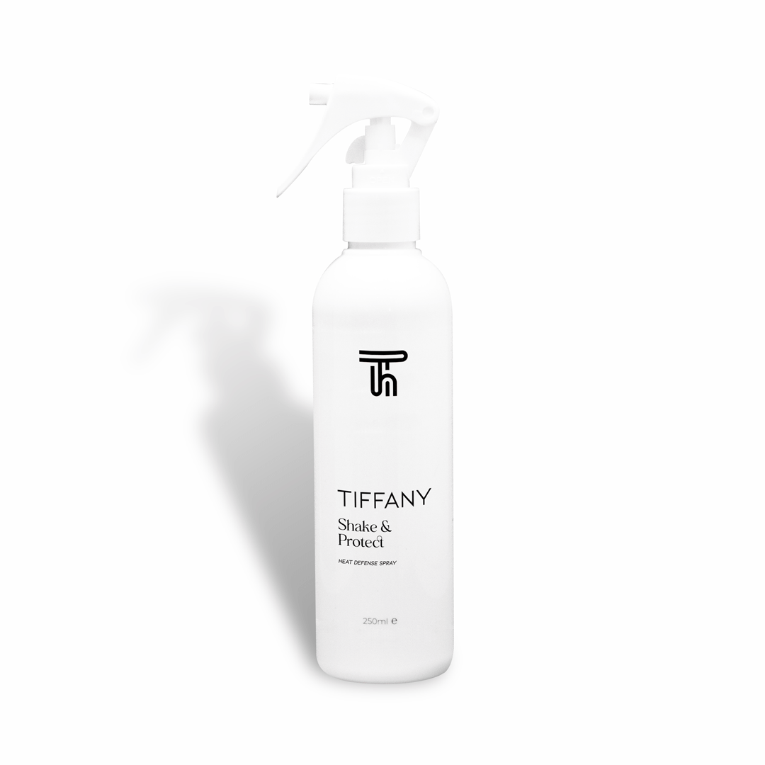 heat defence spray by Tiffany hair on a white background