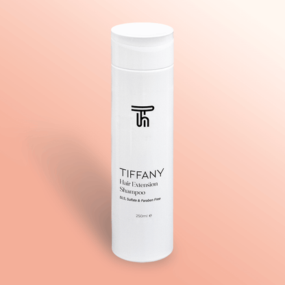 Hair Extensions shampoo by Tiffany hair on a pink gradient background